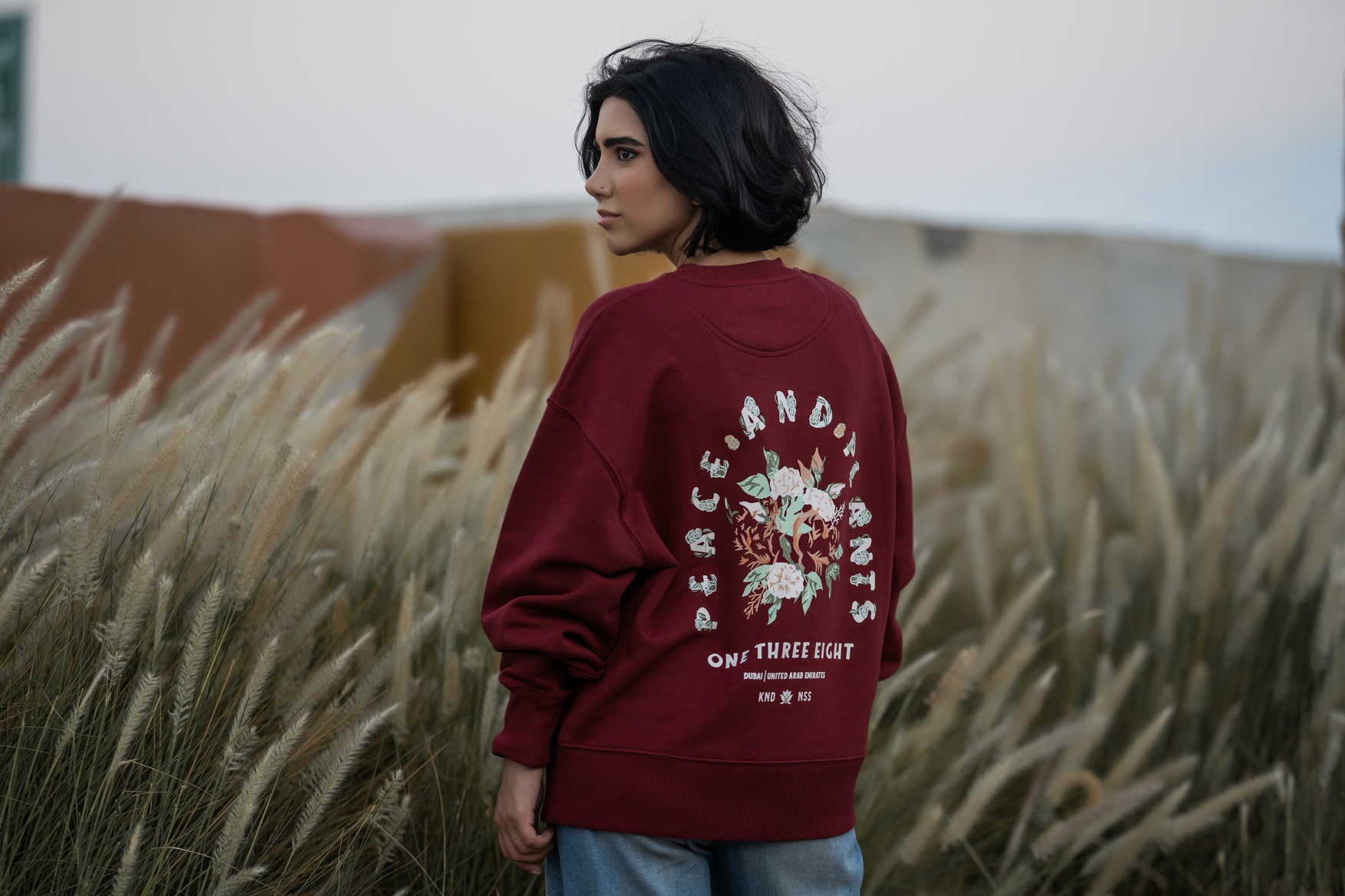 a girl in dubai wearing the environmentally friendly peace and plants oversized shirt from the 138 way